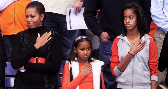 Michelle Obama Saluting Along With Her Daughters