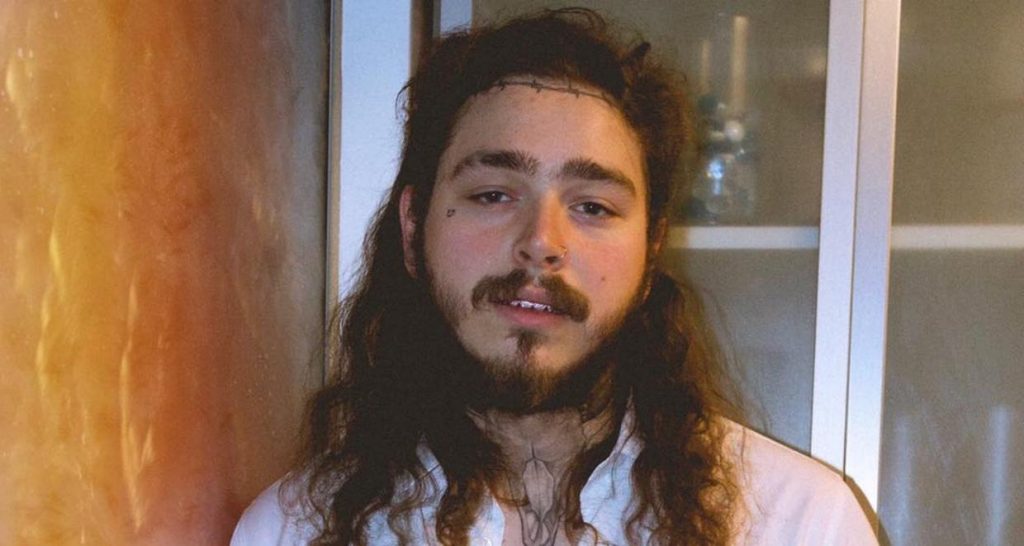 Post Malone enjoys a beer
